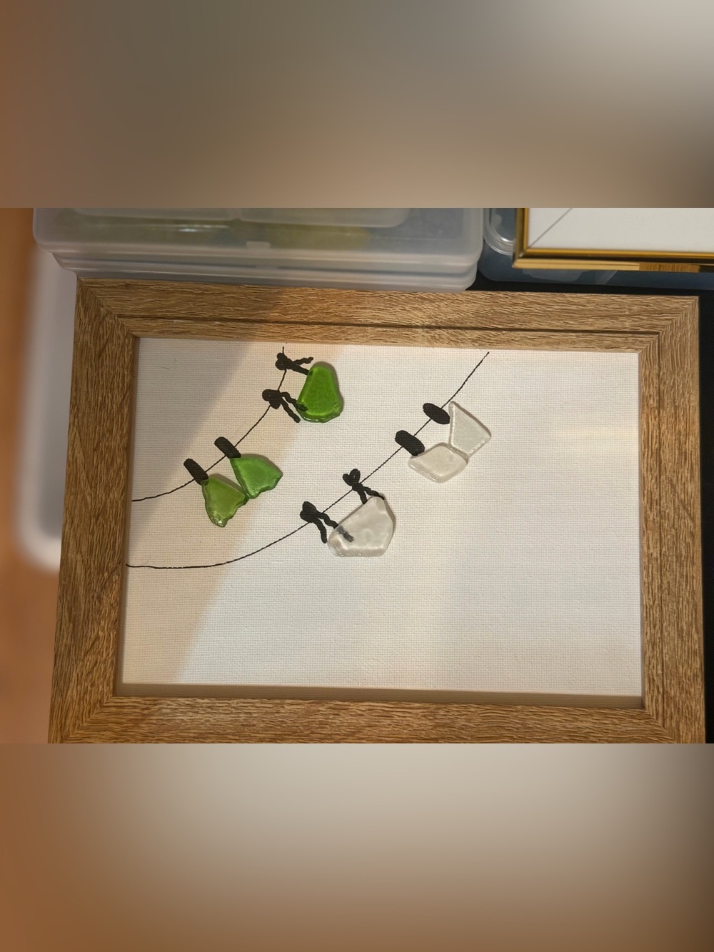 Custom Made Framed Sea Glass Art (bathing suits hanging on line)